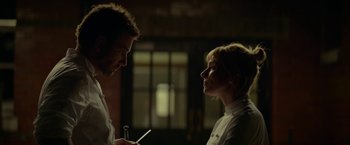 Movie still from “Burnt” (2015), directed by John Wells – A man and a woman looking at each other; Close Up shot, Low angle