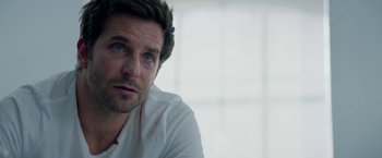 Movie still from “Burnt” (2015), directed by John Wells – A person sitting in front of a window; Close Up shot, Over the shoulder angle