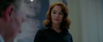 Movie still from “Burnt” (2015), directed by John Wells – A woman with red hair wearing a black shirt; Close Up shot, Over the shoulder angle