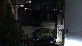 Movie still from “Caché” (2005), directed by Michael Haneke – A car parked in front of a building at night; Extreme Wide shot, Low angle