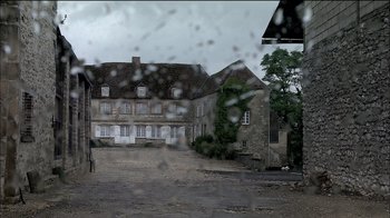 Movie still from “Caché” (2005), directed by Michael Haneke – A view of a building through a window; Extreme Wide shot, High angle