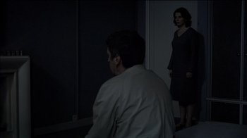 Movie still from “Caché” (2005), directed by Michael Haneke – A man and a woman standing in front of a mirror; Wide shot, Over the shoulder angle