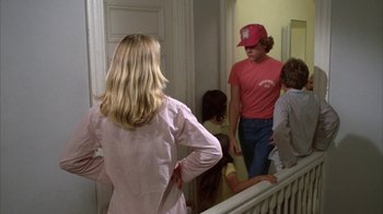 Movie still from “Caddyshack” (1980), directed by Harold Ramis – A group of people standing in a room; Medium shot, Over the shoulder angle