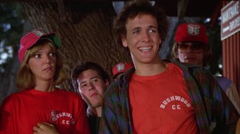 Movie still from “Caddyshack” (1980), directed by Harold Ramis – A group of young men standing next to each other; Close Up shot, Low angle