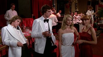 Movie still from “Caddyshack” (1980), directed by Harold Ramis – A man and a woman dressed in formal wear; Wide shot, Over the shoulder angle