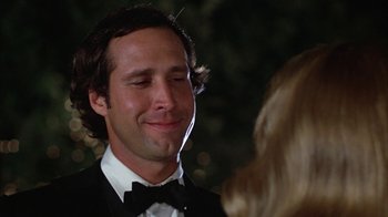 Movie still from “Caddyshack” (1980), directed by Harold Ramis – A person wearing a suit and bow tie; Close Up shot, Low angle