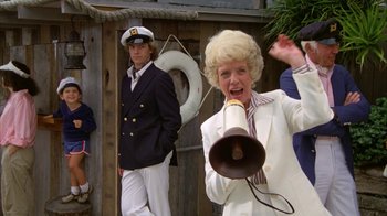 Movie still from “Caddyshack” (1980), directed by Harold Ramis – A man and a woman dressed in sailor outfits; Medium shot, Low angle