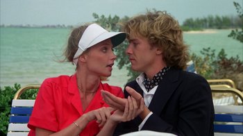 Movie still from “Caddyshack” (1980), directed by Harold Ramis – A man and a woman are talking to each other; Close Up shot, Over the shoulder angle