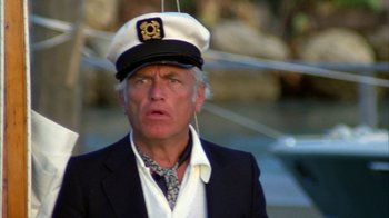 Movie still from “Caddyshack” (1980), directed by Harold Ramis – An older man wearing a sailor's hat and a tie; Close Up shot, Low angle