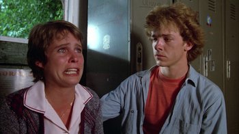 Movie still from “Caddyshack” (1980), directed by Harold Ramis – A woman and a man standing next to each other; Close Up shot, Low angle