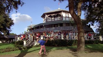 Movie still from “Caddyshack” (1980), directed by Harold Ramis – A crowd of people standing in front of a building; Extreme Wide shot, High angle