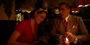 Movie still from “Café Society” (2016), directed by Woody Allen – A man and a woman sitting at a dinner table; Medium shot, Over the shoulder angle