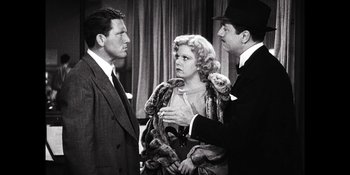 Movie still from “Café Society” (2016), directed by Woody Allen – Two men and a woman are talking to each other; Medium shot, Over the shoulder angle