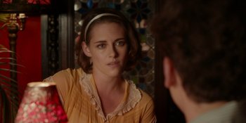 Movie still from “Café Society” (2016), directed by Woody Allen – A woman looking at her reflection in a mirror; Close Up shot, Over the shoulder angle