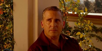 Movie still from “Café Society” (2016), directed by Woody Allen – A person wearing a brown shirt; Close Up shot, Over the shoulder angle