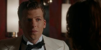 Movie still from “Café Society” (2016), directed by Woody Allen – A person wearing a suit and bow tie; Close Up shot, Over the shoulder angle