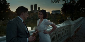 Movie still from “Café Society” (2016), directed by Woody Allen – A man and a woman standing next to each other on a bridge; Medium shot, High angle