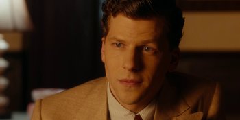 Movie still from “Café Society” (2016), directed by Woody Allen – A person wearing a suit and tie; Close Up shot, Over the shoulder angle