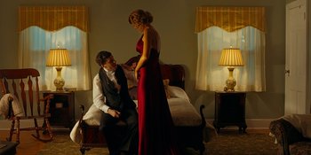 Movie still from “Café Society” (2016), directed by Woody Allen – A man and a woman dressed in formal wear; Medium shot, Low angle