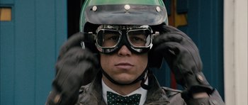 Movie still from “Calvary” (2014), directed by John Michael McDonagh – A man wearing a green helmet and goggles; Close Up shot, Low angle