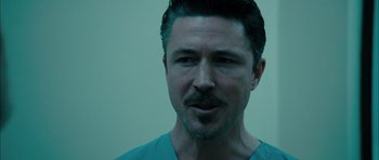 Movie still from “Calvary” (2014), directed by John Michael McDonagh – A person wearing a blue shirt; Close Up shot, Low angle