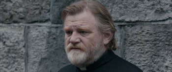 Movie still from “Calvary” (2014), directed by John Michael McDonagh – An old man with a beard and a white beard; Close Up shot, Low angle