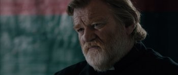 Movie still from “Calvary” (2014), directed by John Michael McDonagh – An old man with a beard and a white beard; Close Up shot, Low angle