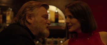 Movie still from “Calvary” (2014), directed by John Michael McDonagh – An older man and a younger woman face to face; Close Up shot, Low angle