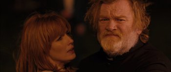 Movie still from “Calvary” (2014), directed by John Michael McDonagh – A man and a woman looking at each other; Close Up shot, Over the shoulder angle