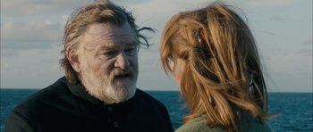 Movie still from “Calvary” (2014), directed by John Michael McDonagh – A man and a woman talking on the beach; Close Up shot, Over the shoulder angle