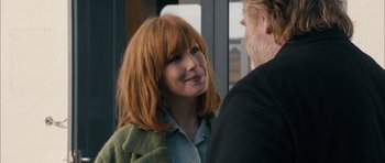 Movie still from “Calvary” (2014), directed by John Michael McDonagh – A person with long red hair; Close Up shot, Over the shoulder angle