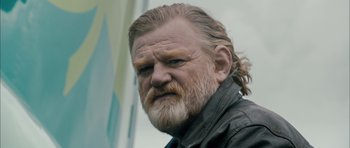 Movie still from “Calvary” (2014), directed by John Michael McDonagh – An older man with a beard and a mustache; Close Up shot, Low angle