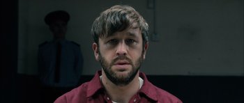 Movie still from “Calvary” (2014), directed by John Michael McDonagh – A person with a beard; Close Up shot, Over the shoulder angle