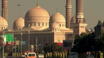 Movie still from “Cameraperson” (2016), directed by Kirsten Johnson – A view of a mosque from the street; Extreme Wide shot, Low angle