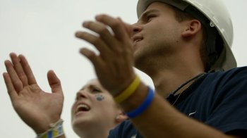 Movie still from “Cameraperson” (2016), directed by Kirsten Johnson – A man and a woman clapping their hands in the air; Close Up shot, Low angle