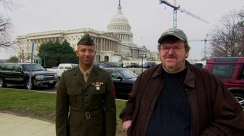 Movie still from “Cameraperson” (2016), directed by Kirsten Johnson – Two men standing next to each other in front of the capitol building; Medium shot, Over the shoulder angle