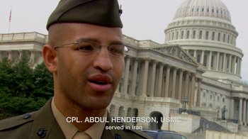 Movie still from “Cameraperson” (2016), directed by Kirsten Johnson – A man in a military uniform standing in front of a building; Close Up shot, Low angle