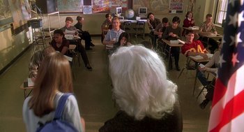Movie still from “Can't Hardly Wait” (1998), directed by Deborah Kaplan – A group of people sitting in a room; Medium shot, High angle