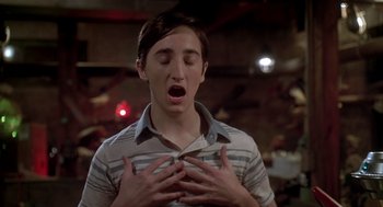 Movie still from “Can't Hardly Wait” (1998), directed by Deborah Kaplan – A young man with his mouth wide open and his eyes closed; Close Up shot, Low angle