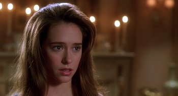 Movie still from “Can't Hardly Wait” (1998), directed by Deborah Kaplan – A person with long brown hair; Close Up shot, Over the shoulder angle
