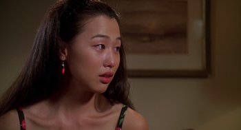 Movie still from “Can't Hardly Wait” (1998), directed by Deborah Kaplan – A young woman with long dark brown hair wearing a black top; Close Up shot, Over the shoulder angle