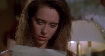 Movie still from “Can't Hardly Wait” (1998), directed by Deborah Kaplan – A person looking down at a piece of paper; Close Up shot, Over the shoulder angle