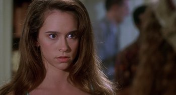 Movie still from “Can't Hardly Wait” (1998), directed by Deborah Kaplan – A woman with long brown hair stares into the camera; Close Up shot, Over the shoulder angle