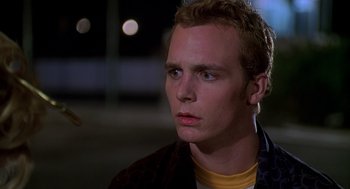 Movie still from “Can't Hardly Wait” (1998), directed by Deborah Kaplan – A young man is looking into the distance; Close Up shot, Over the shoulder angle