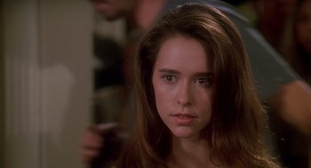 Movie still from “Can't Hardly Wait” (1998), directed by Deborah Kaplan – A person with long brown hair; Close Up shot, Over the shoulder angle