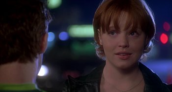 Movie still from “Can't Hardly Wait” (1998), directed by Deborah Kaplan – A person wearing a leather jacket; Close Up shot, Over the shoulder angle