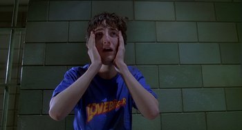 Movie still from “Can't Hardly Wait” (1998), directed by Deborah Kaplan – A person with their hands on their face; Close Up shot, High angle