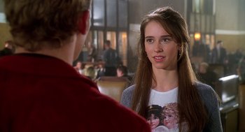 Movie still from “Can't Hardly Wait” (1998), directed by Deborah Kaplan – A young woman talking to a young man in front of a crowd; Close Up shot, Over the shoulder angle