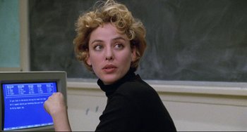 Movie still from “Candyman” (1992), directed by Bernard Rose – A woman with blonde curly hair is holding a tablet; Close Up shot, Over the shoulder angle