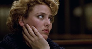 Movie still from “Candyman” (1992), directed by Bernard Rose – A person with her hand on her chin; Close Up shot, Low angle